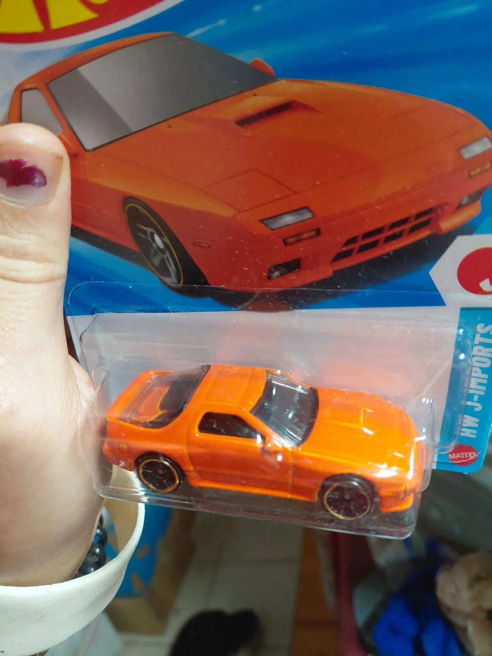 the Hot Wheels '89 Mazda Savanna RX-7 FC3S in orange, part of the 2026 HW J-Impo